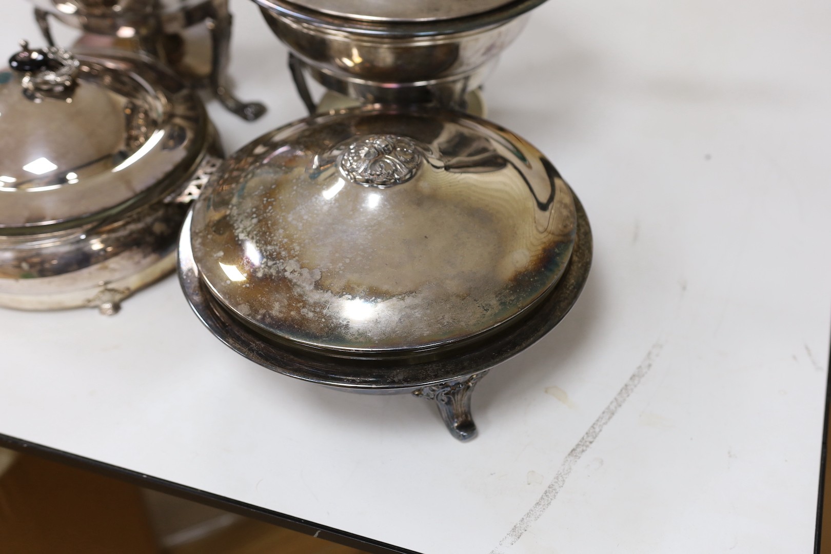 A pair of silver plated bain marie and two matching tureens with covers